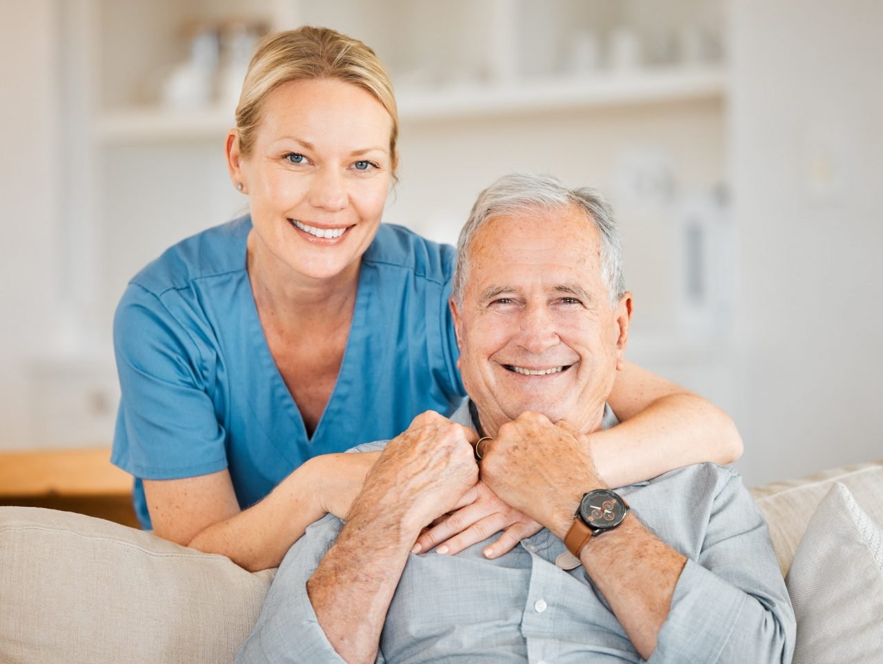 Woman offering elderly care services to an old man